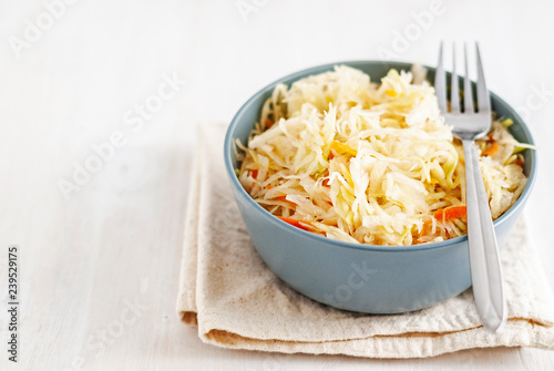 Bowl with sauerkraut and fork