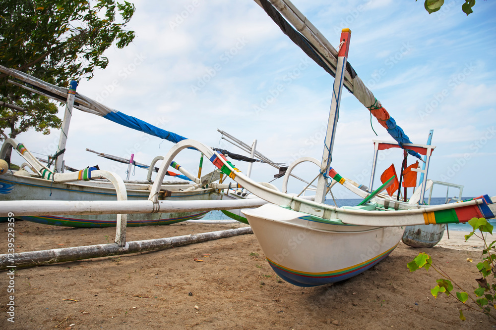 Traditional colorful fishing boats on the beach on Bali, Indonesia Traditional colorful fishing boats on the beach on Bali, Indonesia