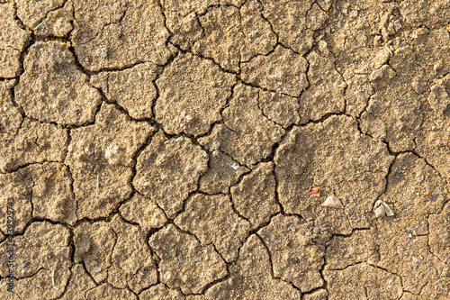 Beautiful texture of cracked dry ground in the countryside background.