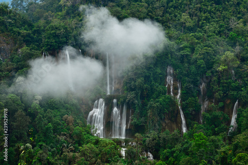 Great waterfall in Thailand. Beautiful waterfall in the green forest. Waterfall in tropical forest at Umpang National park, Tak, Thailand. photo