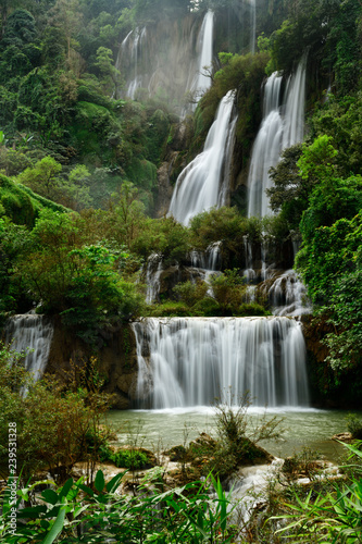 Fototapeta Naklejka Na Ścianę i Meble -  Great waterfall in Thailand. Beautiful waterfall in the green forest. Waterfall in tropical forest at Umpang National park, Tak, Thailand.