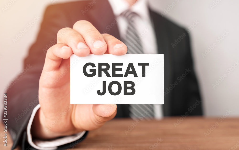 Businessman holding a card with text Great Job