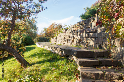 Cottage garden with stone stairs and retaining wall