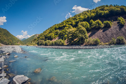 landscape beautiful stormy turquoise mountain river sunny day