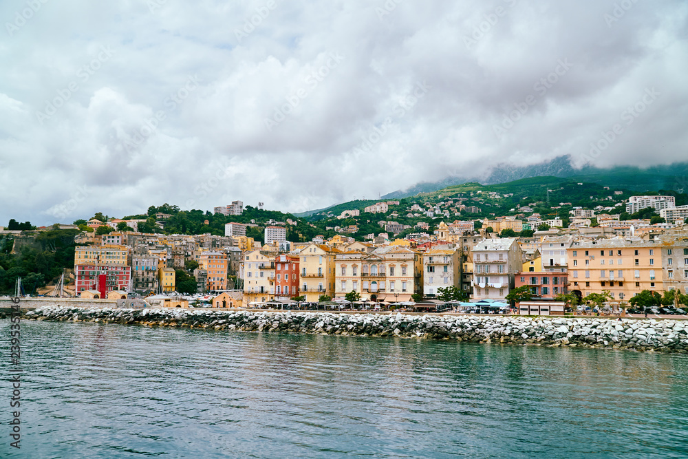 View of Bastia city in Corsica from the port on cloudy day, Corse