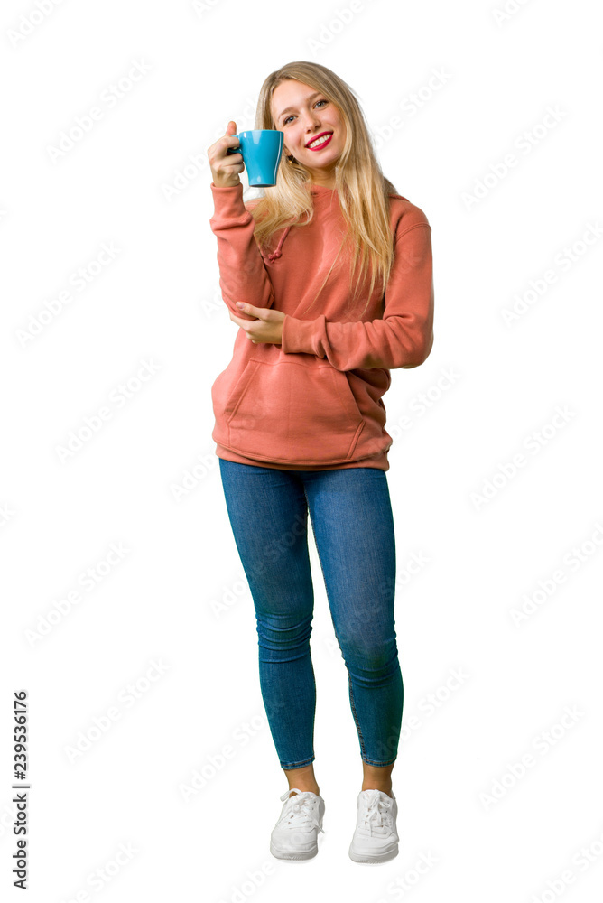 A full-length shot of a Young girl holding a hot cup of coffee on isolated white background A full-length shot of a Young girl holding a hot cup of coffee on isolated white background