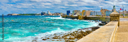 The Havana skyline and the iconic Malecon seawall with a stormy ocean photo