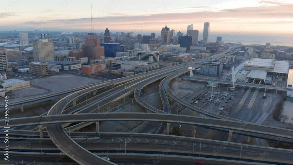 Aerial view of highway in american city at dawn. Downtown Milwaukee, Wisconsin, United States. Drone shots, from above
Aerial view of highway in american city at dawn. Downtown Milwaukee, Wisconsin, United States. Drone shots, from above