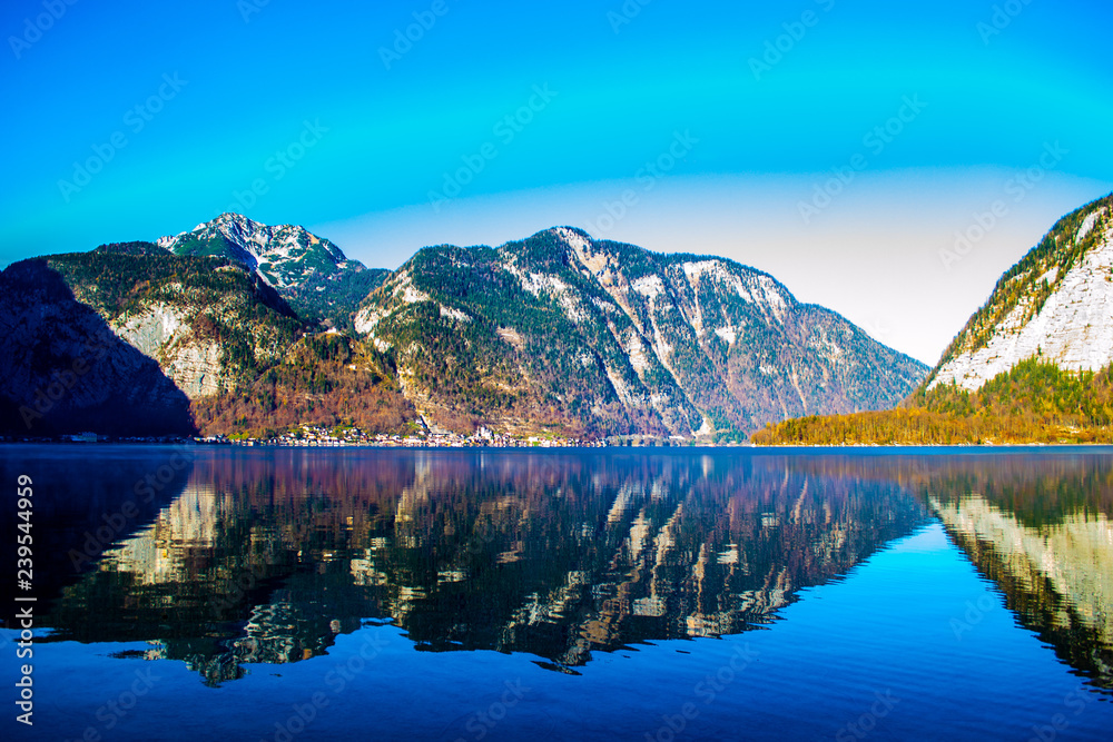 The lake is surrounded by beautiful mountains, mountains, pines, trees, spring, fog over the water