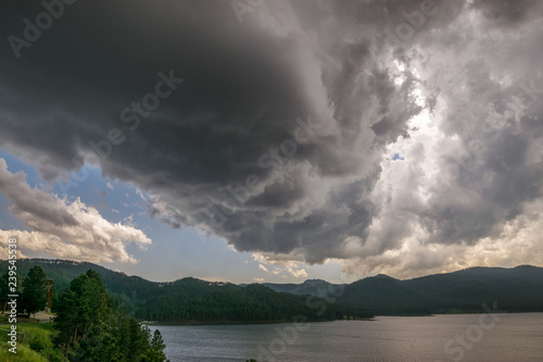 Dramatic storm clouds over Pactola Lake in the Black Hills area of South Dakota photo