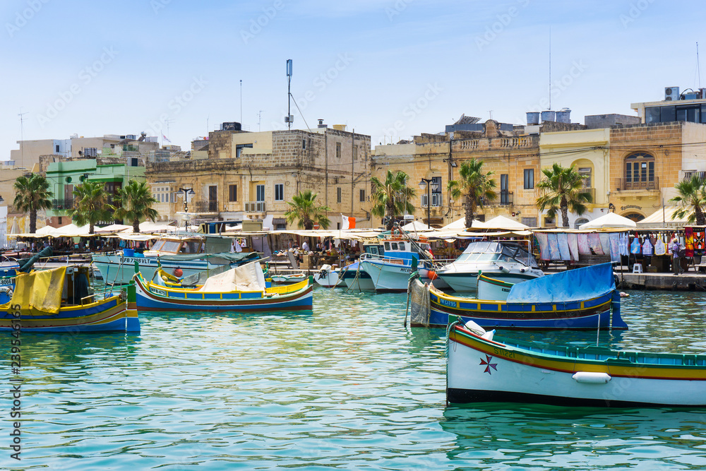 VALLETTA, MALTA - June 28, 2017: Mediterranean traditional colorful boats in Malta