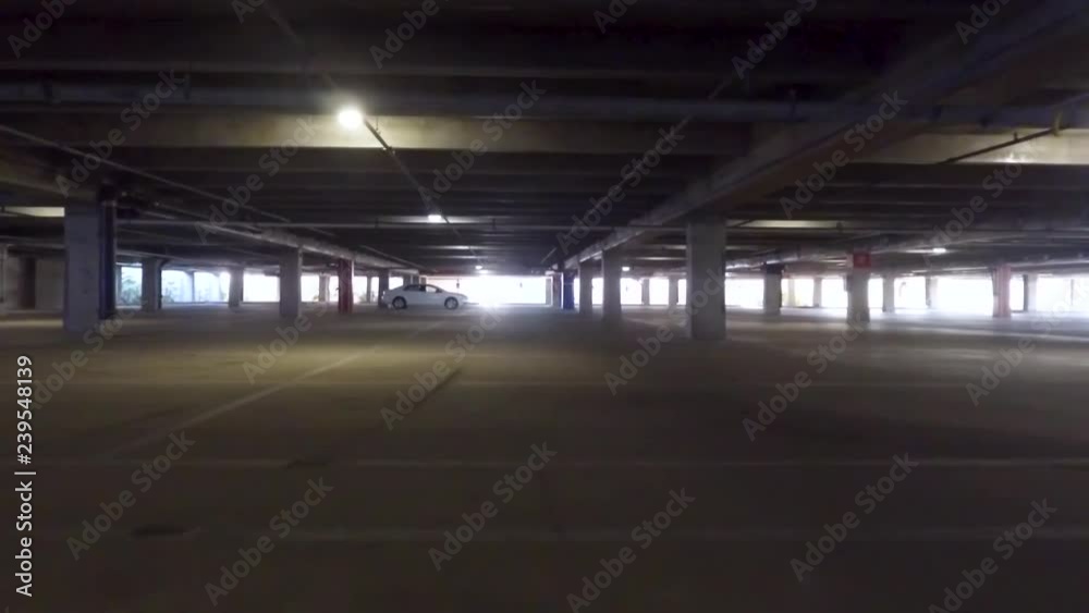 Car driving through parking garage Car driving through parking garage