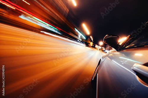 Car on the road with motion blur background. © grthirteen
