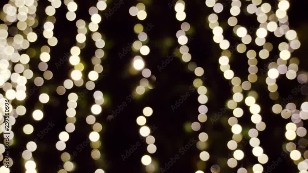 Winter holidays. Blinking blurred christmas tree lights bokeh on background. 4K Winter holidays. Blinking blurred christmas tree lights bokeh on background. 4K