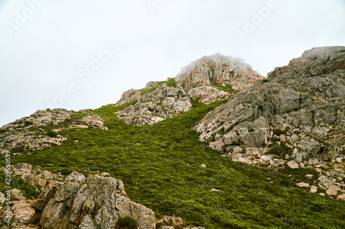 Minimalist high altitude mountain in the clouds in Corsica Corse France © Lukas