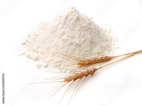 White flour pile or heap with golden spike or ears isolated on white background