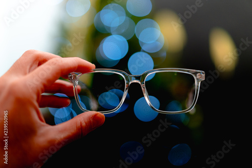 Holding glasses up in front of lights
