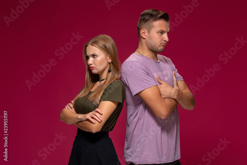 Картината върху платно Studio portrait of a young couple in casual wear quarreled and taking a step towards reconciliation