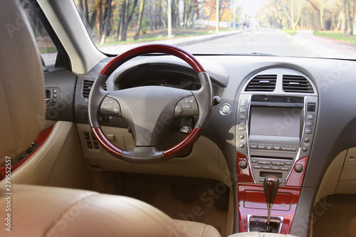 Car interior. Car dashboard, illuminated panel, speed display © Stasiuk