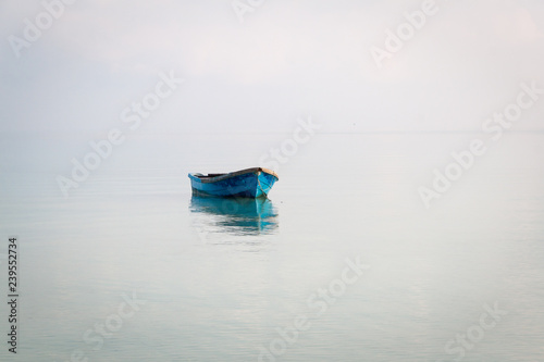 Blue boat on the sea in Koh Rong Samloem, Cambodia photo
