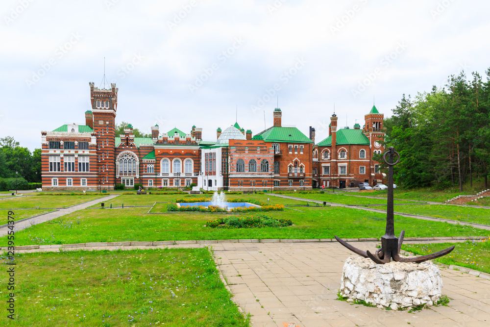 Sheremetev castle palace and park ensemble in the village of Yurino on the bank of the Volga, combination of different architectural styles in one building. Cloudy weather at the beginning of summer.