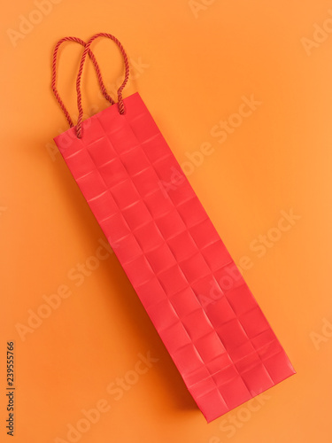 Red cardboard gift bag on o...