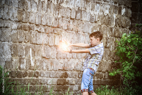 A bright flash of magical flame from the hands of a young wizard, the magic of action in action.