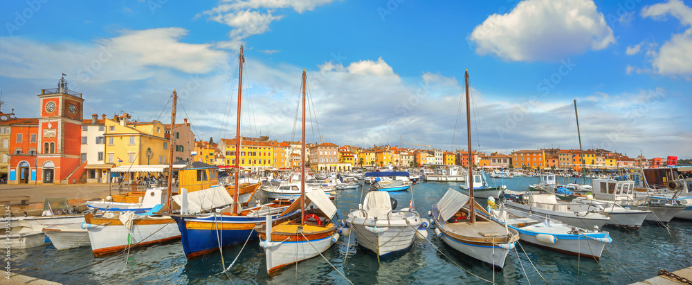 Cityscape with bell tower and marina in harbour of Rovinj town. Istria, Croatia