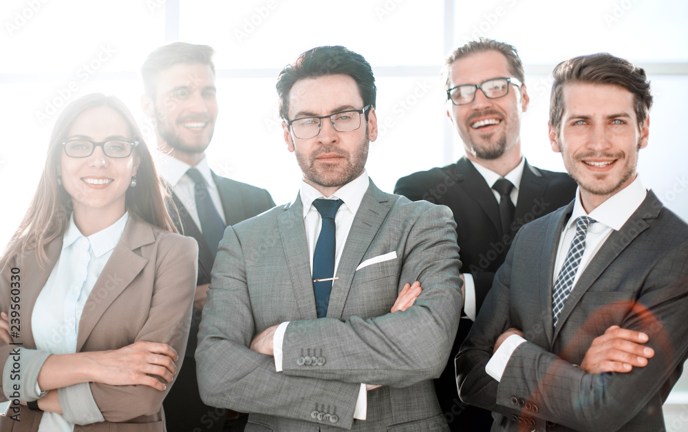 Group of business partners looking at camera with smiles Group of business partners looking at camera with smiles