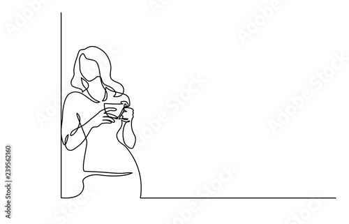 Woman relaxing with cup of tea Continuous line
