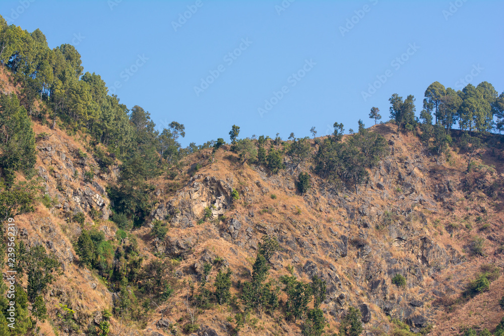 Peaks of rocky hills with occasionally vegetation