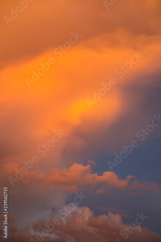 Dramatic clouds at colourful moody sunset
