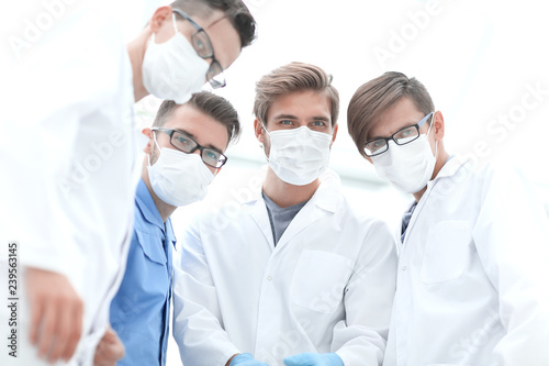 closeup. a team of doctors in protective masks.