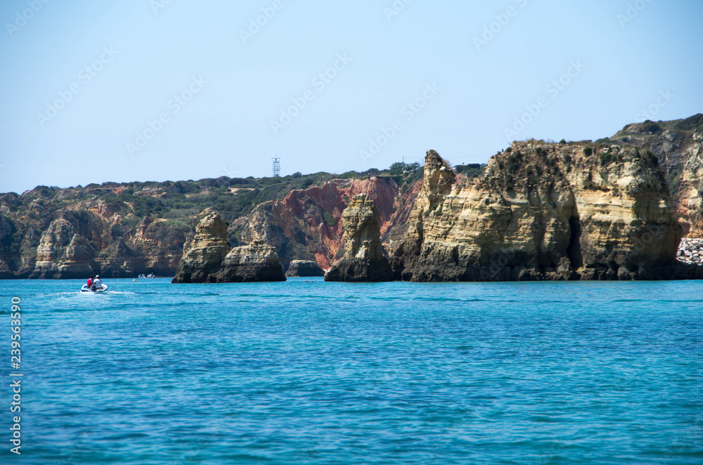 Rocky formations from Ponta da Piedade with boat on the left sid