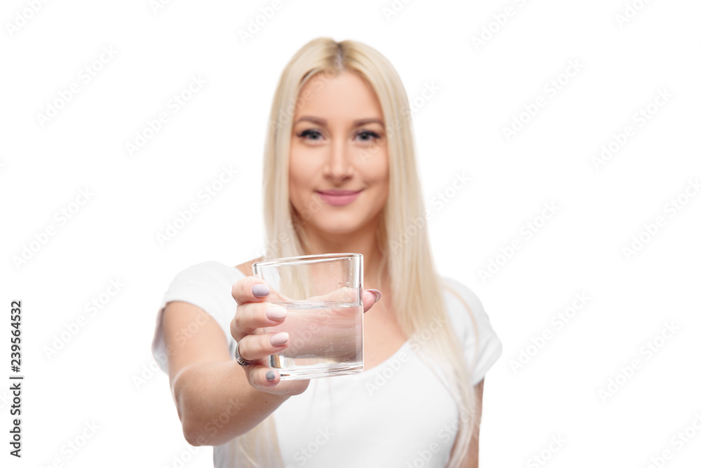 Healthy blond woman holding and drink glass of pure water on isolated white background Healthy blond woman holding and drink glass of pure water on isolated white background