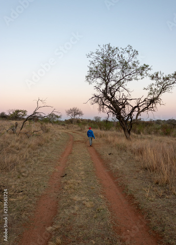 Boy on dirt road in African bush