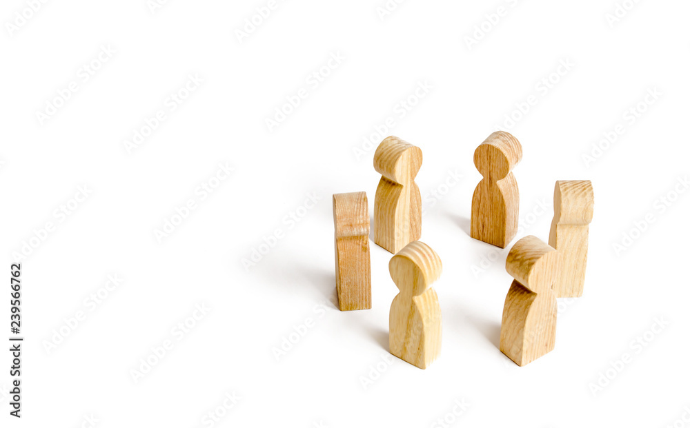 People stand in a circle on a white background. Communication. Business team, teamwork, team spirit. Wooden figures of people. friends teamwork. discussion and cooperation, coordination cooperation.
