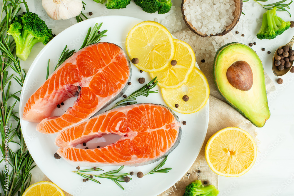 Delicious fresh fish steaks, salmon, trout. With vegetables, deli, vegan food, diet and Dotex Delicious fresh fish steaks, salmon, trout. With vegetables, deli, vegan food, diet and Dotex