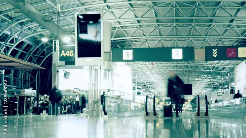 Time lapse of a busy crowded generic airport terminal. Long exposure motion blur
