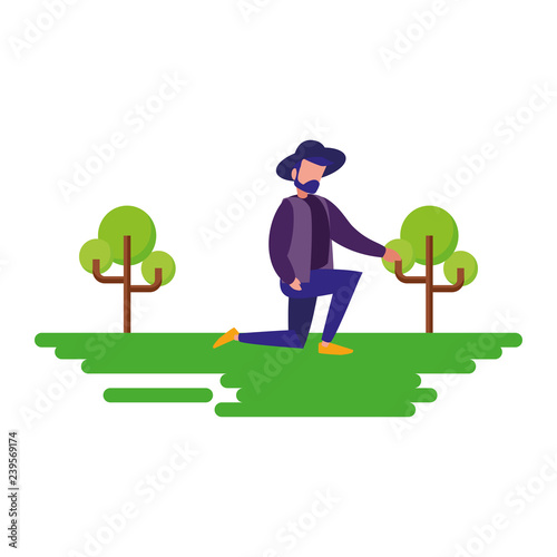 man with hat on the knee natural outdoor