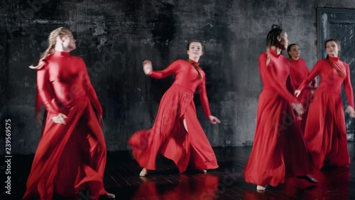 Group of smiling talented girl dancing together, group dance rehearsal.