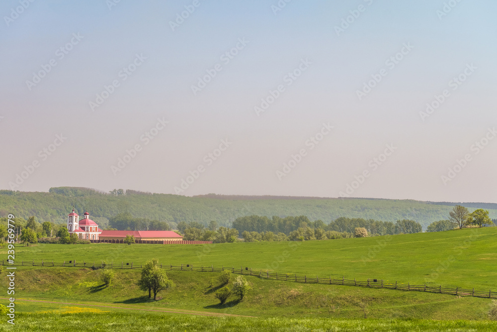 Fototapeta premium Church of Saint Nicholas on Green meadow. Kamenka village, Lipetsk Region, Russia. 1784 year of construction.