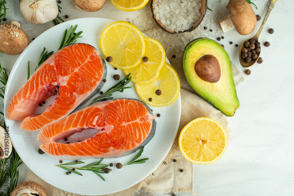 Delicious fresh fish steaks, salmon, trout. With vegetables, deli, vegan food, diet and Dotex Delicious fresh fish steaks, salmon, trout. With vegetables, deli, vegan food, diet and Dotex