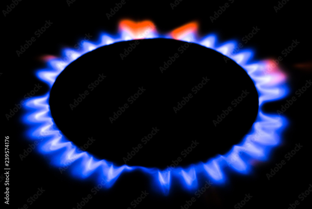 Burning gas. Burning gas on the gas stove. Blue flames on burning gas. Burning gas. Burning gas on the gas stove. Blue flames on burning gas.