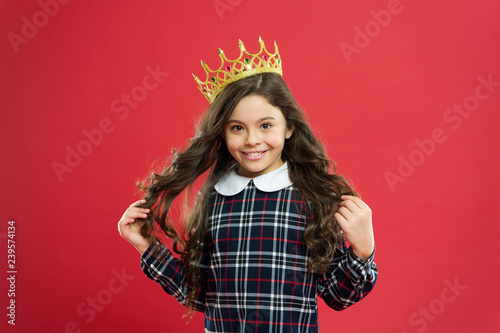 Every girl dreaming become princess. Lady little princess. Girl wear crown red background. Spoiled child concept. Egocentric princess. World spinning around me. Kid wear golden crown symbol princess
