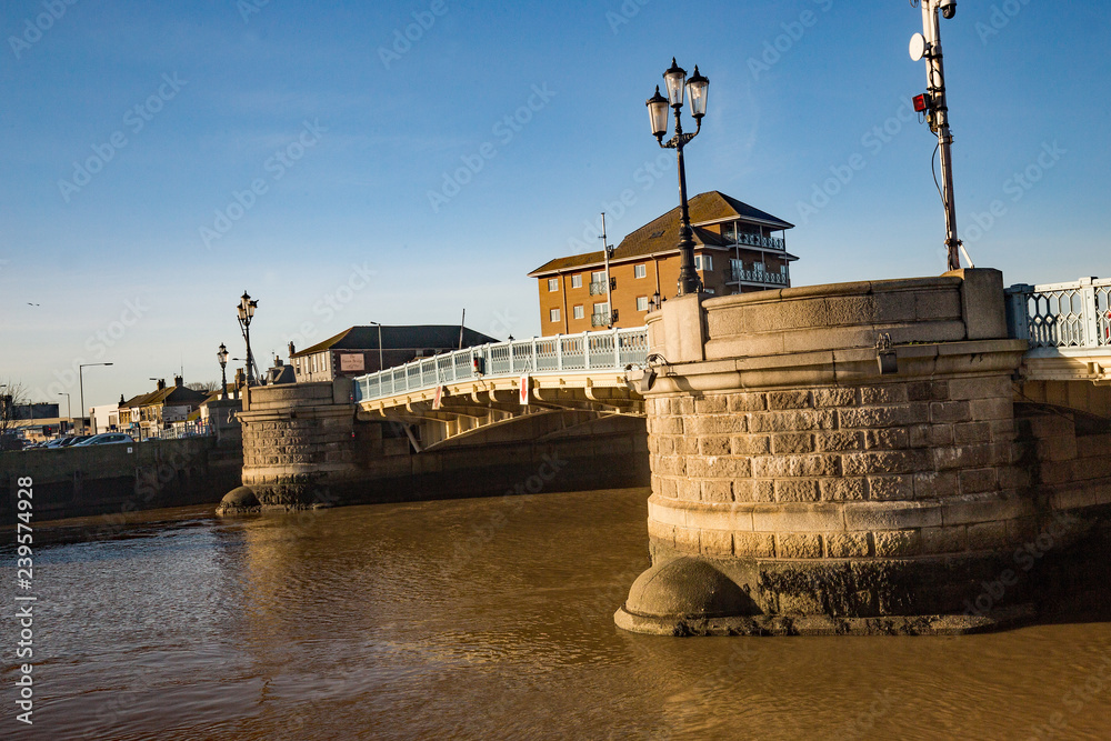Fototapeta premium Road bridge over the river in a bright and sunny day
