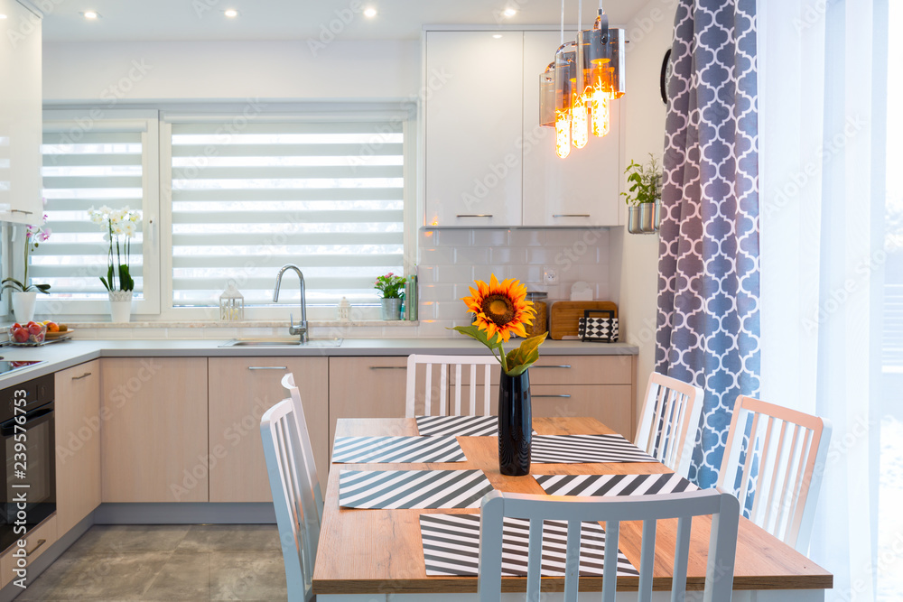 Fototapeta premium Modern kitchen interior with dining table
