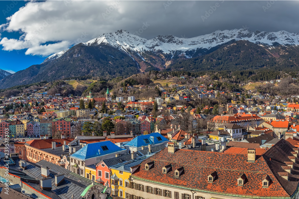 People in Innsbruck city center under Stadtturm tower. It is capital city of Tyrol in western Austria, Europe.