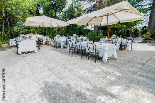 Outdoor restaurant tables ready for wedding party