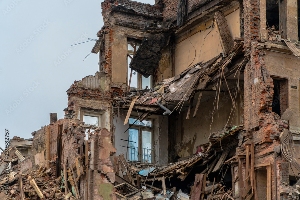 The wreckage and the skeleton of an old building destroyed to make room for modern development